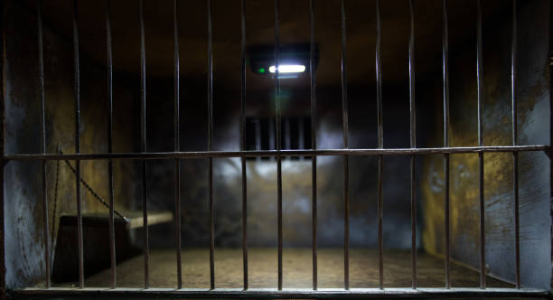 istock Jail or prison cell. Old grunge prison miniature. Dark prison interior creative decoration. Empty cell. Selective focus Obsolete gray grunge concrete room. 1280239342