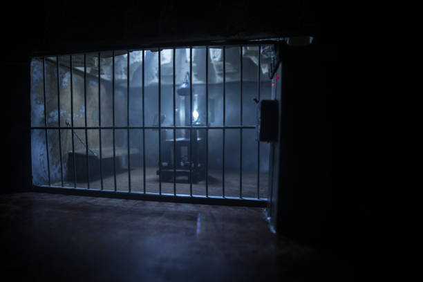 istock Jail or prison cell. Obsolete gray grunge concrete room. Old prison miniature. Execution concept 1280239352