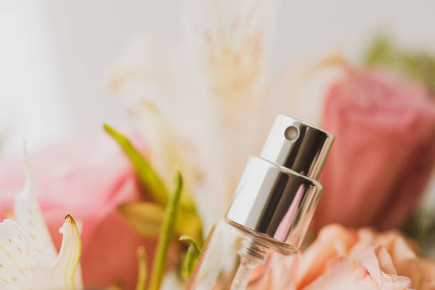 istock perfume bottle in a floral pattern. soft focus. perfume product advertisement. elegant composition 1280240434