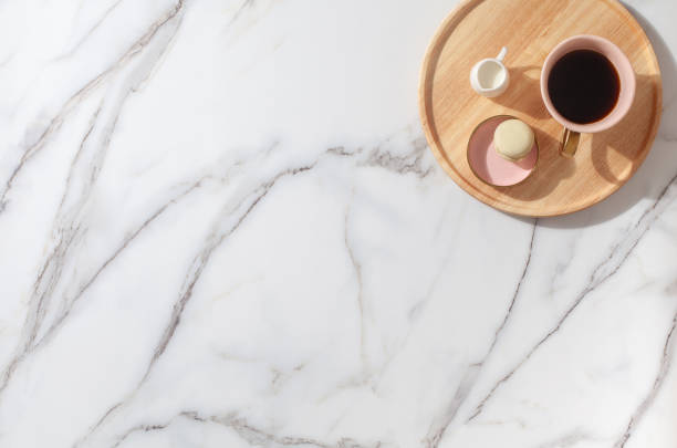 istock Minimal workspace with diary, pen, cup of coffee, milk, french macaron 1280240448