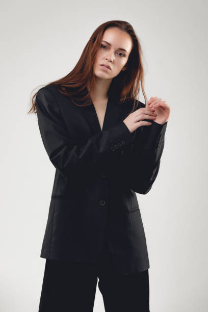 istock Portrait of young model at the studio with gray isolated background and copy space. Lady is posing and gesturing 1280241143