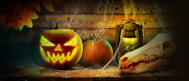 istock Scary Halloween pumpkin with eyes glowing inside on wooden background 1280242090