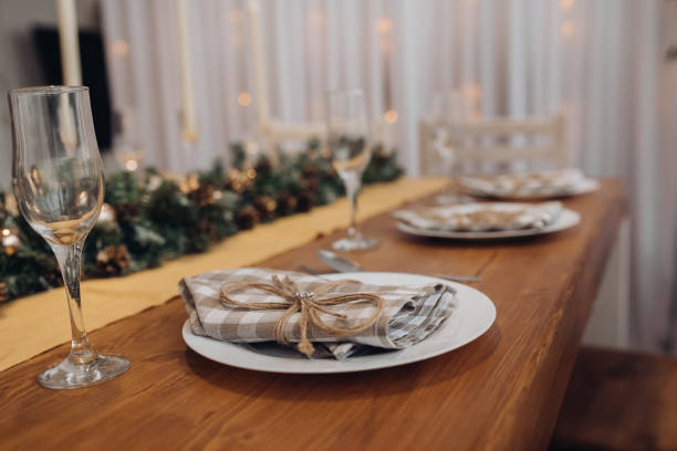 istock Beautiful Christmas serving table with candles and fir-tree decoration at cozy modern interior 1280243891