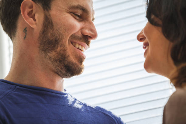 istock Wife and husband smiling at each other 1280246848