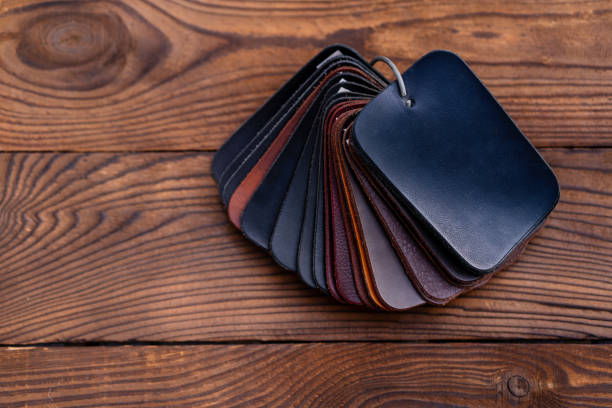 istock Leather samples for shoes on dark wooden table. 1280246996