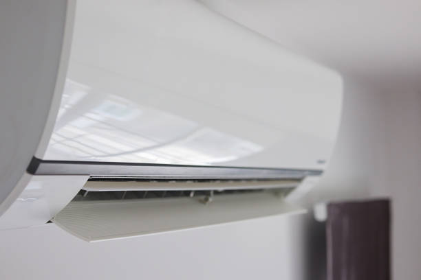 istock Air conditioner on white wall room interior background 1280247071