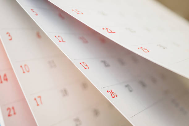 istock Calendar page flipping sheet close up on office table background business schedule planning appointment meeting concept 1280247096
