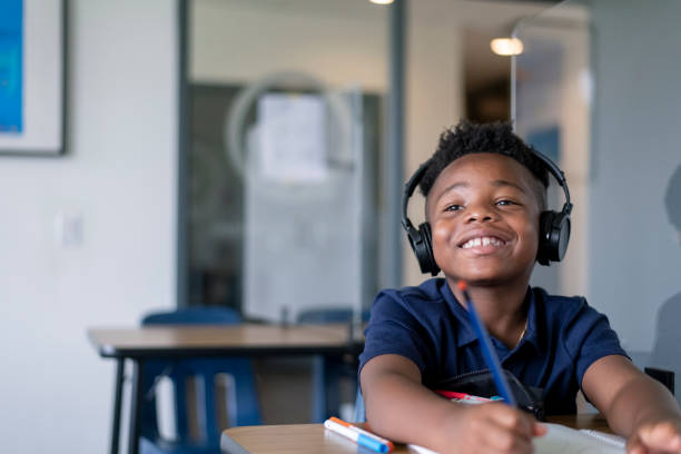 istock Portrait of cute elementary age boy at school 1280247239