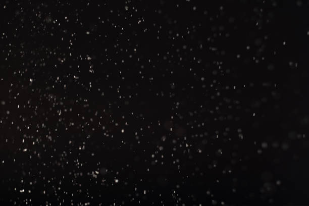istock snow abstract background white bokeh lights black 1280247386