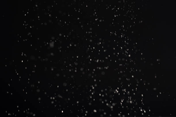 istock snow background white bokeh lights black winter 1280247388