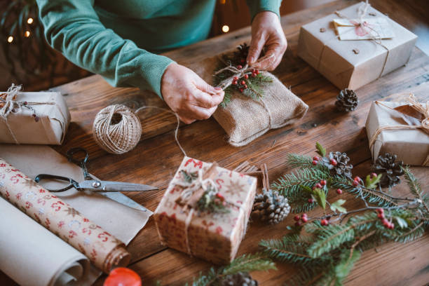 istock Woman decorating Christmas gifts. 1280247732
