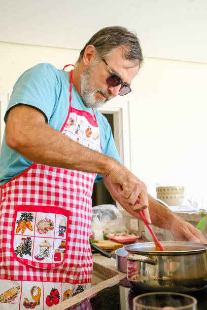 istock Senior man cooking wearing sunglasses 1280257205