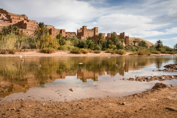 Ait Benhaddou, Morocco View of Ait Benhaddou Kasbah with river reflection, Morocco. moroccan currency photos stock pictures, royalty-free photos & images