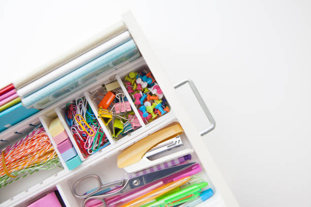 istock Female white workplace. A method for storing stationery neatly. Stylish colored pens, stapler, pencils 1280257962