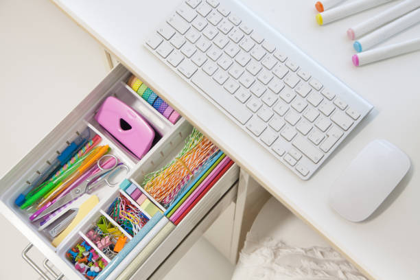 istock Female white workplace. A method for storing stationery neatly. Stylish colored pens, stapler, pencils 1280261772