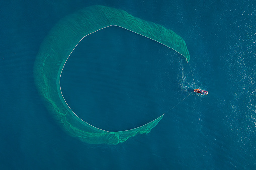 Drone view of fishing boat on the sea, looks like wings of the boat