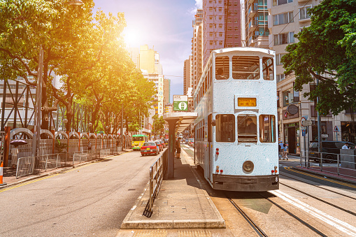 Hong Kong - June 29, 2022 : A tram featuring an advertisement celebrating the 25th anniversary of Hong Kong's handover from Britain to China, in Sheung Wan, Hong Kong.