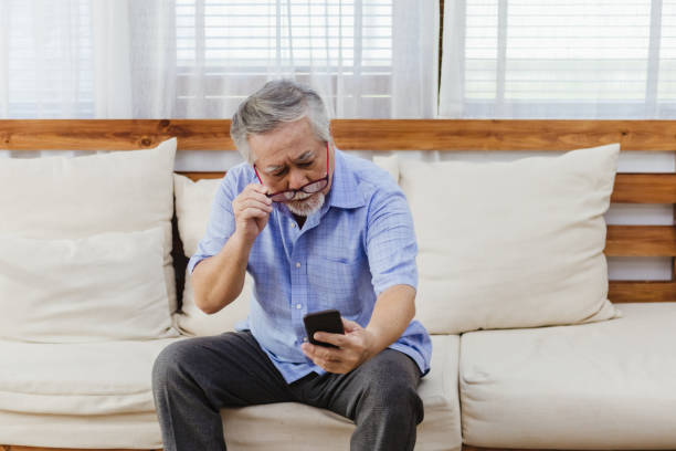 istock Asian senior fatigue man taking off glasses during using smartphone 1280272120