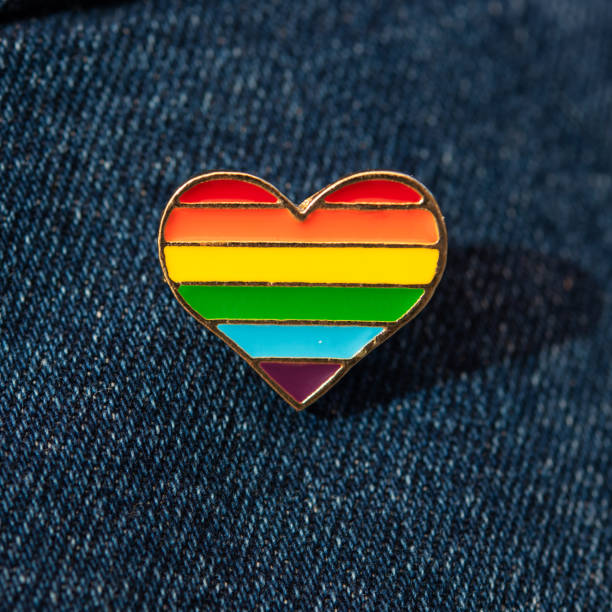 istock Rainbow color lgbt heart badge on jeans. 1280272384