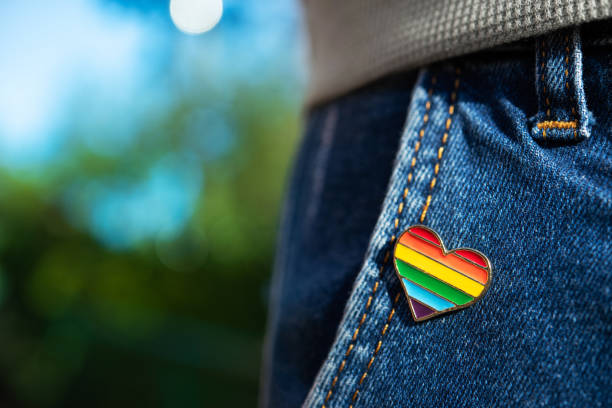 istock Rainbow color lgbt heart badge on jeans. 1280272396