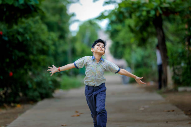 Indian School boy running at playground
