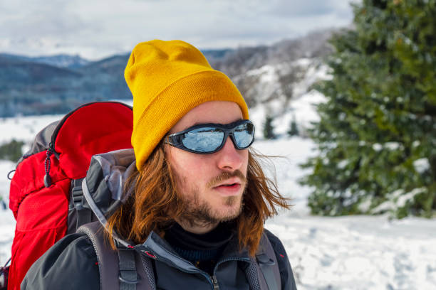 istock Man hiking in snow mountains 1280273171