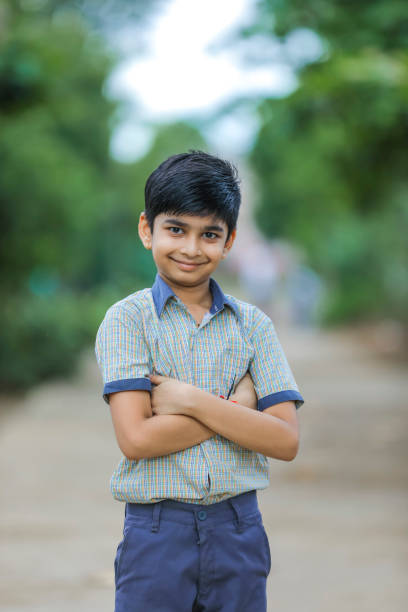 Cute little indian Indian / Asian school boy wearing uniform