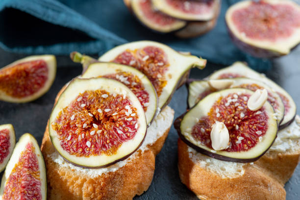 istock Tasty bruschetta with cream cheese, figs 1280274786