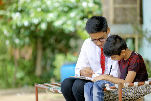 istock two Indian child studying at home 1280274956