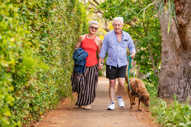 istock Activate Senior Couple Walking The Dog 1280275059