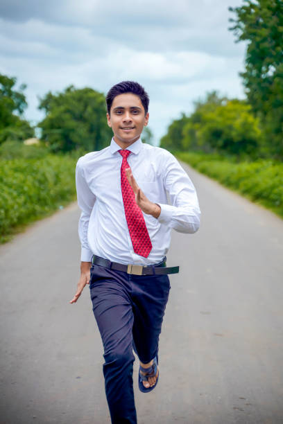istock Young asian / Indian boy running on the road 1280275763