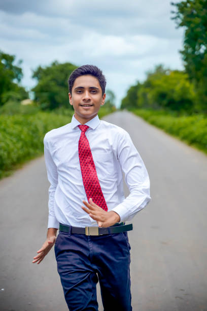 istock Young asian / Indian boy running on the road 1280276013