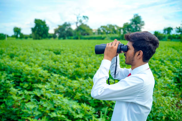 istock Indian man enjoys in nature with binoculars 1280277833