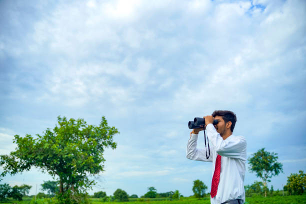 istock Indian man enjoys in nature with binoculars 1280277956