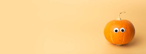 istock Pumpkin minimal concept. Autumn pumpkin on an empty colored banner background. Thanksgiving and halloween concept 1280280523