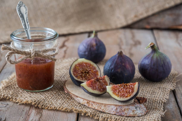 istock Fig jam in a jar on a rustic wooden table 1280281607