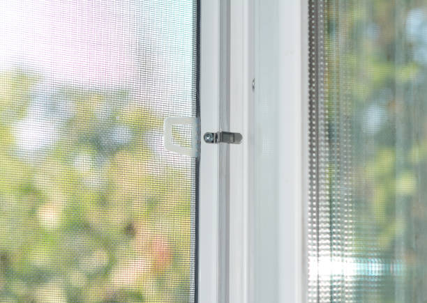 istock A close-up on a plastic window with a mosquito net, fly screen, insect barrier to protect the house from insects and bugs in summer. 1280283363