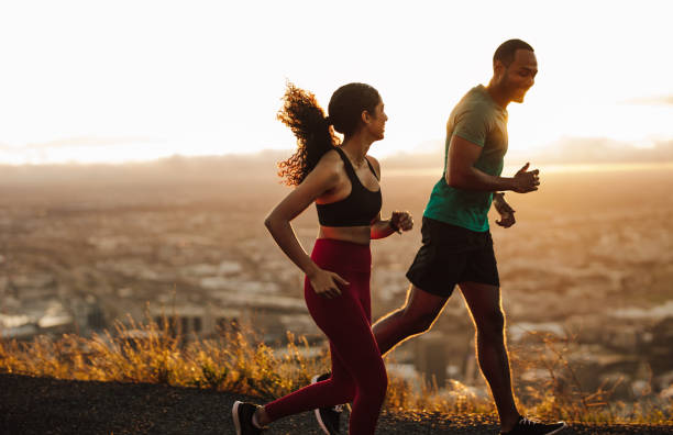 istock Athletic couple running in the morning 1280283792