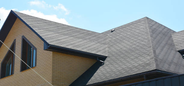 istock A close-up on a roof problem area covered with asphalt roof shingles and irregular shape window on the wall of the house construction. 1280285015