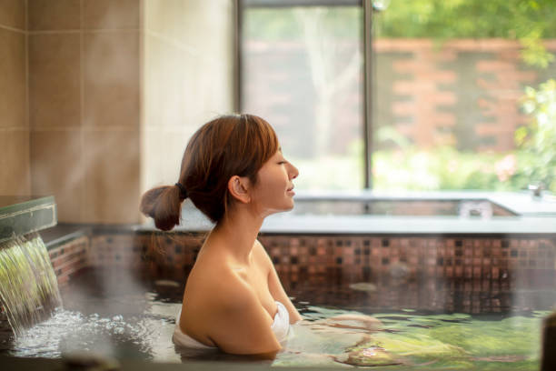 istock Asian Young woman relaxing in hot spring 1280287364