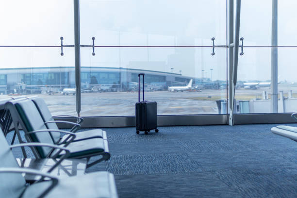 istock A black suitcase in the airport terminal 1280288846