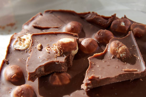 istock Chocolate with whole nuts eaten by small worms. 1280292745