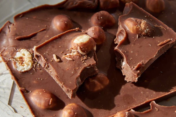 istock Chocolate with whole nuts eaten by small worms. 1280292750
