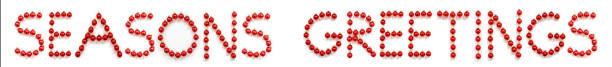 istock Red Christmas Ball Ornament Building Word Seasons Greetings 1280296252