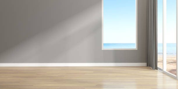 istock 3d render of empty room with wooden floor and large plain wall on sea background. 1280296962