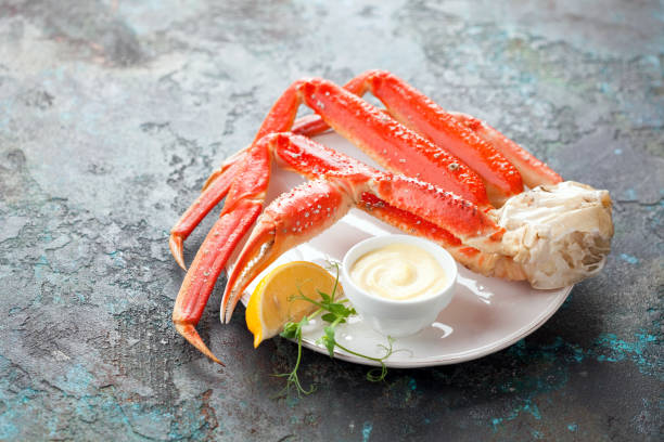 Crab legs with mayonnaise sauce Crab legs with mayonnaise sauce, selective focus snow crab photos stock pictures, royalty-free photos & images