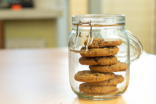 istock Oat cookies in jar with copy space, blurry background 1280298249