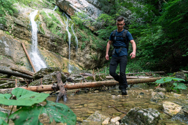 istock Young Caucasian man walking through water 1280303483