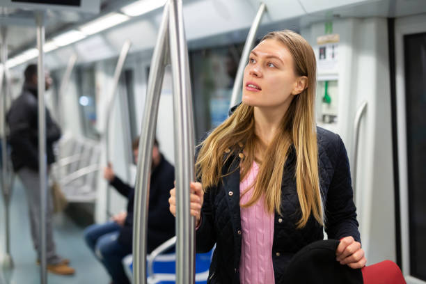 istock Young woman in subway car 1280304640