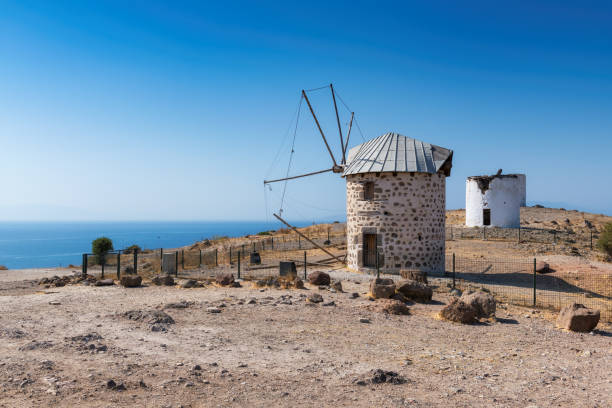 istock Old windmill in autumn sunny day on Mediterranean cost 1280304699